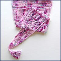 pink crochet shawl with tassel