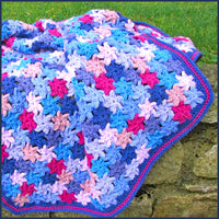 crochet flower blanket on wall
