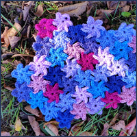 fragment of crochet blanket with interlocking flower motifs