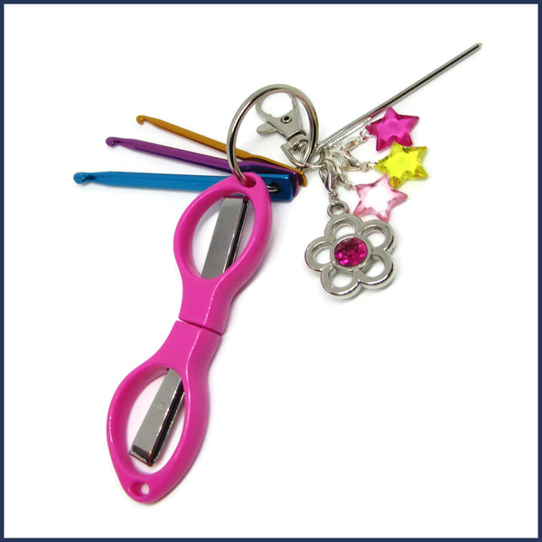 crochet travel kit with pink scissors and mini crochet hooks