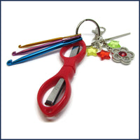 crochet travel kit with red scissors and mini crochet hooks