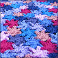 close up of a crochet flower blanket 
