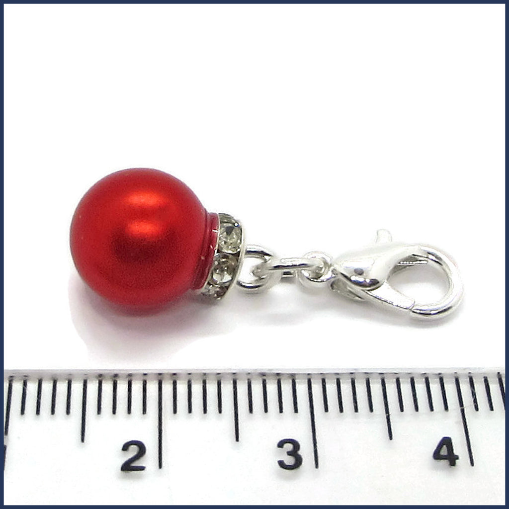 red Christmas ornament stitch marker with ruler