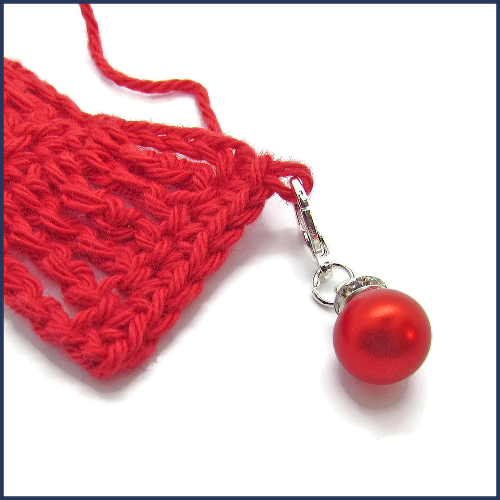 red Christmas ornament stitch marker with crochet