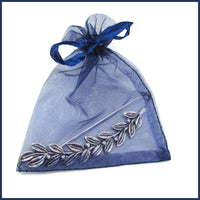 silver leaf and berries shawl pin in an organza bag