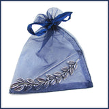 silver leaf and berries shawl pin in an organza bag