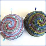two crochet pin cushions