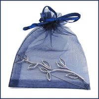 silver feather shawl pin/brooch in a blue organza bag
