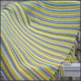 stripey crochet blanket on a garden chair