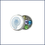 glass star stitch markers in an ammonite tin