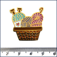 basket of knitting and crochet yarn pin badge with ruler